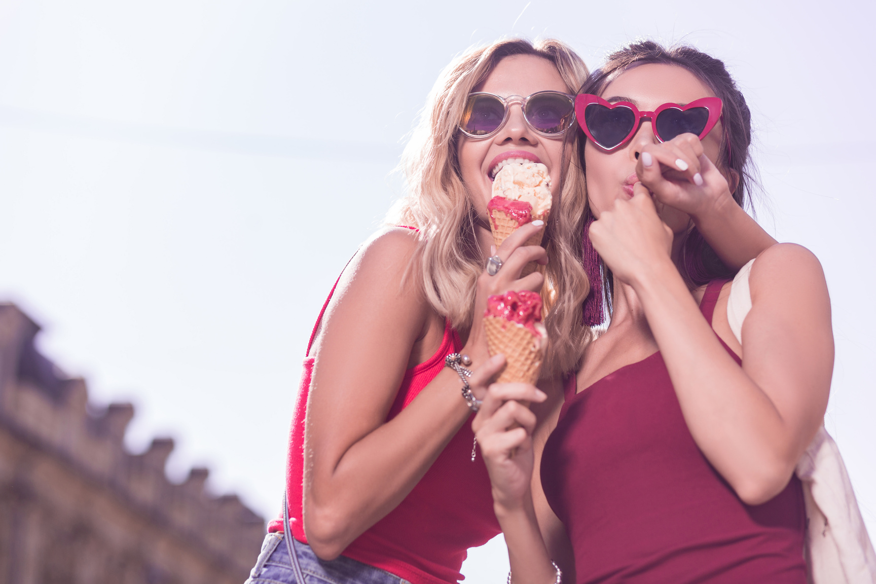 Positive joyful women enjoying tasty ice cream